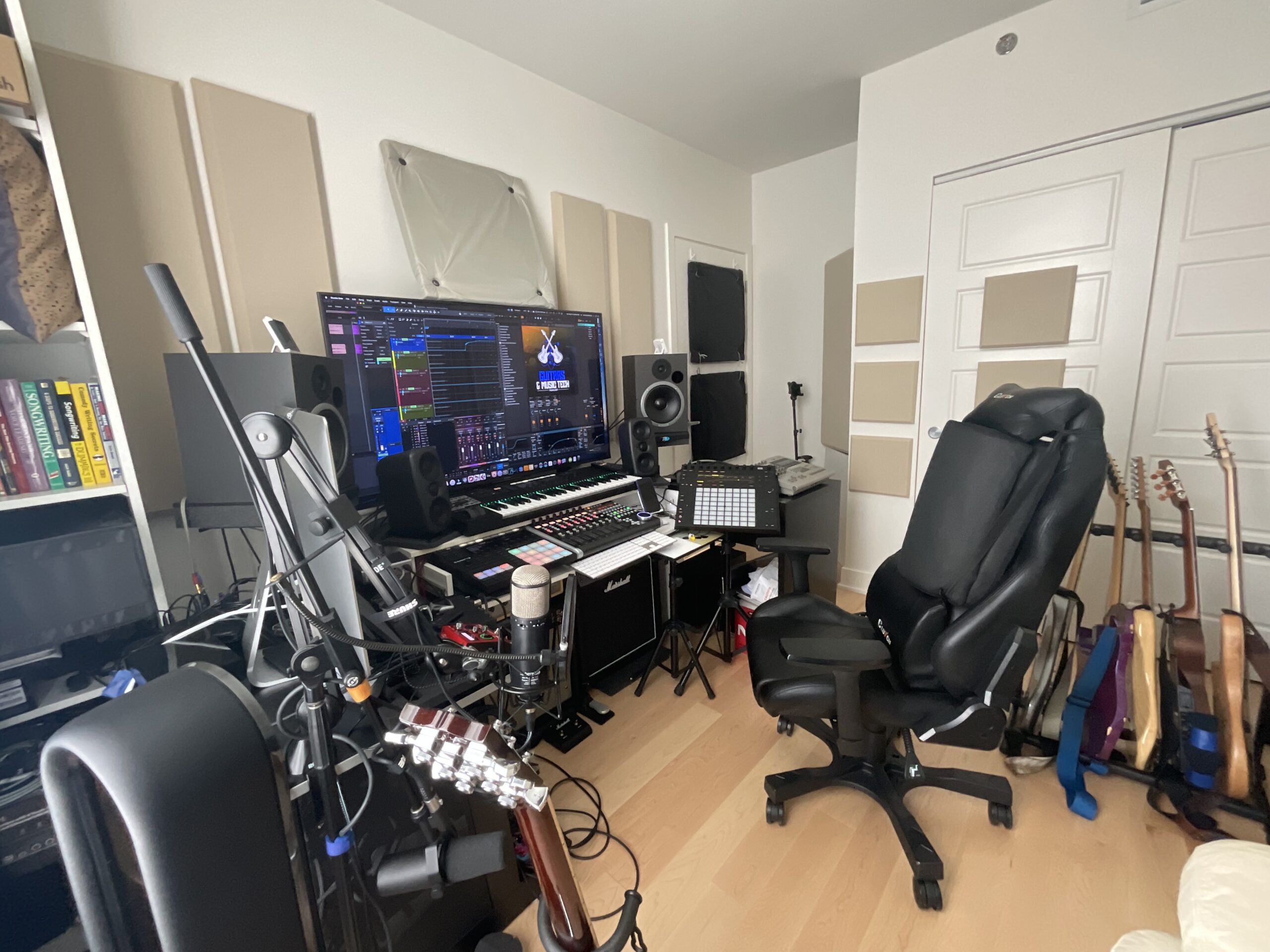 Guitar Musicians control room with workstation, microphones and guitars